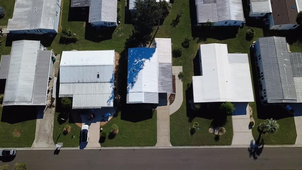 116 Lyonia Lane Wildwood, FL 34785 - Photo 3 of 37 an aerial view of multiple houses with yard