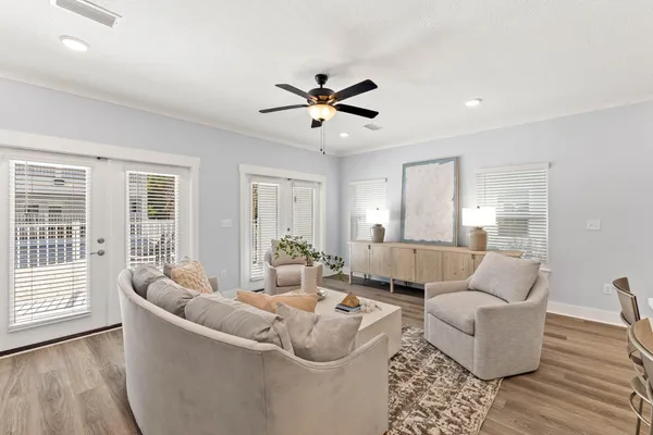 a living room with furniture and a large window