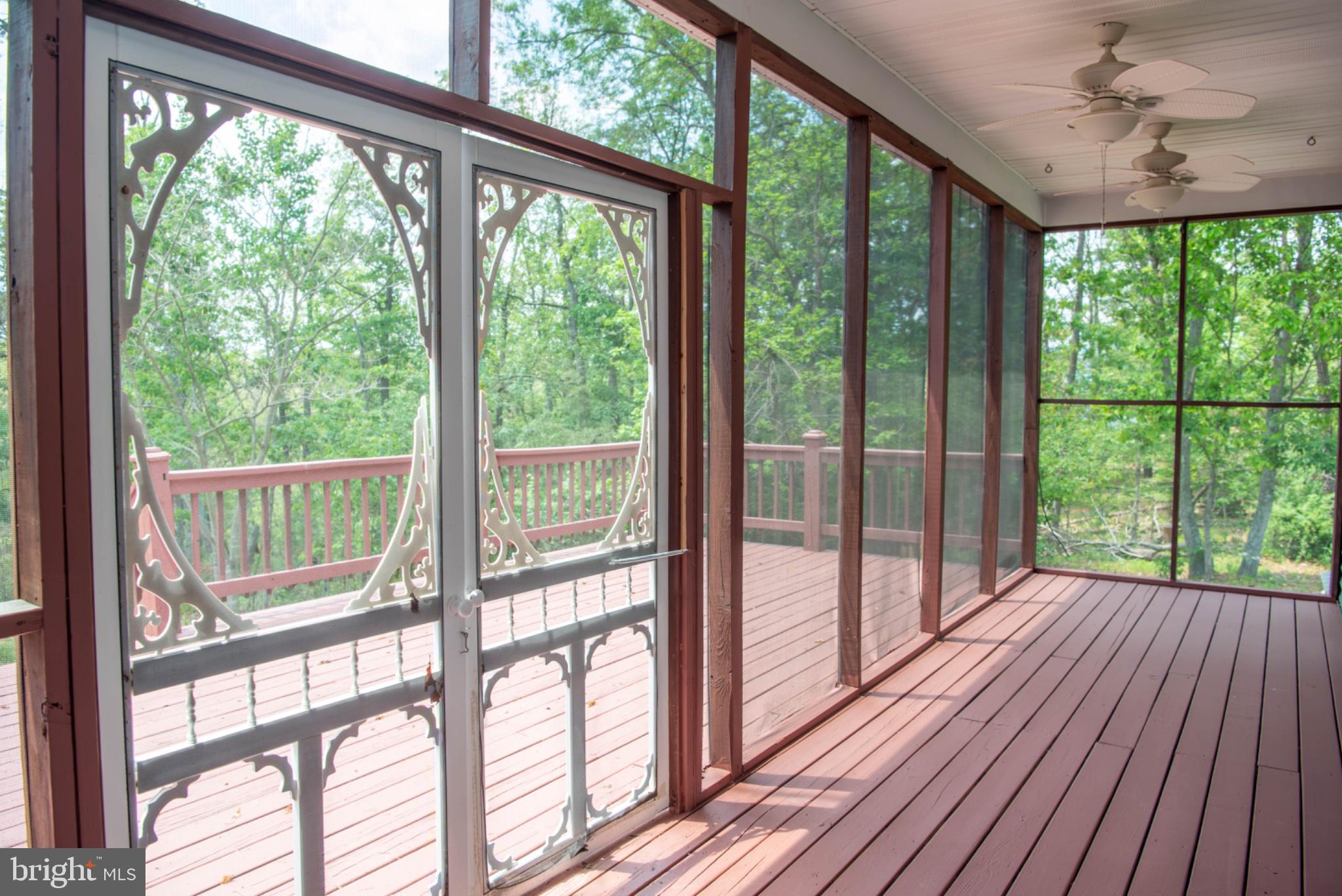 792 Forest Glen Road Moorefield, WV 26836 - Photo 77 of 146 Serene screened porch with nature views.