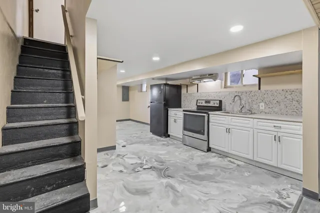 a kitchen with granite countertop cabinets and steel stainless steel appliances