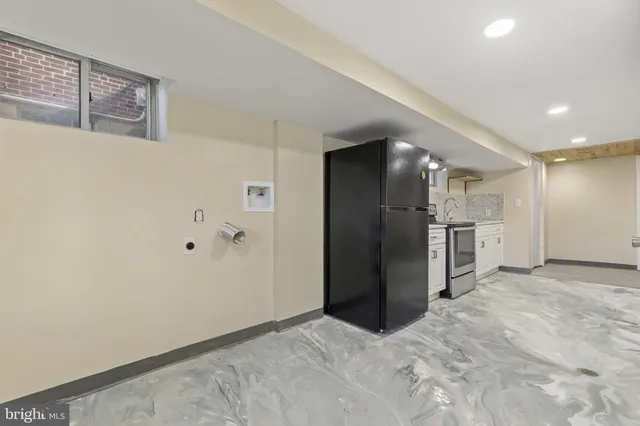 a view of a kitchen with a refrigerator