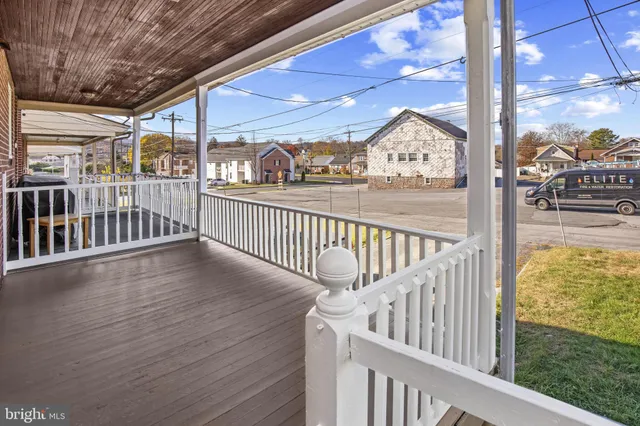 a view of balcony with wooden floor