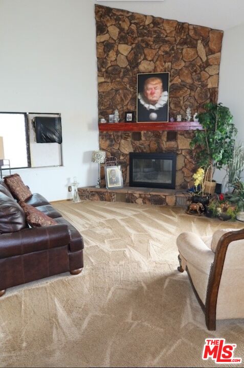 13330 Tamarisk Road Victorville, CA 92395 - Photo 12 of 33 a living room with furniture and a fireplace