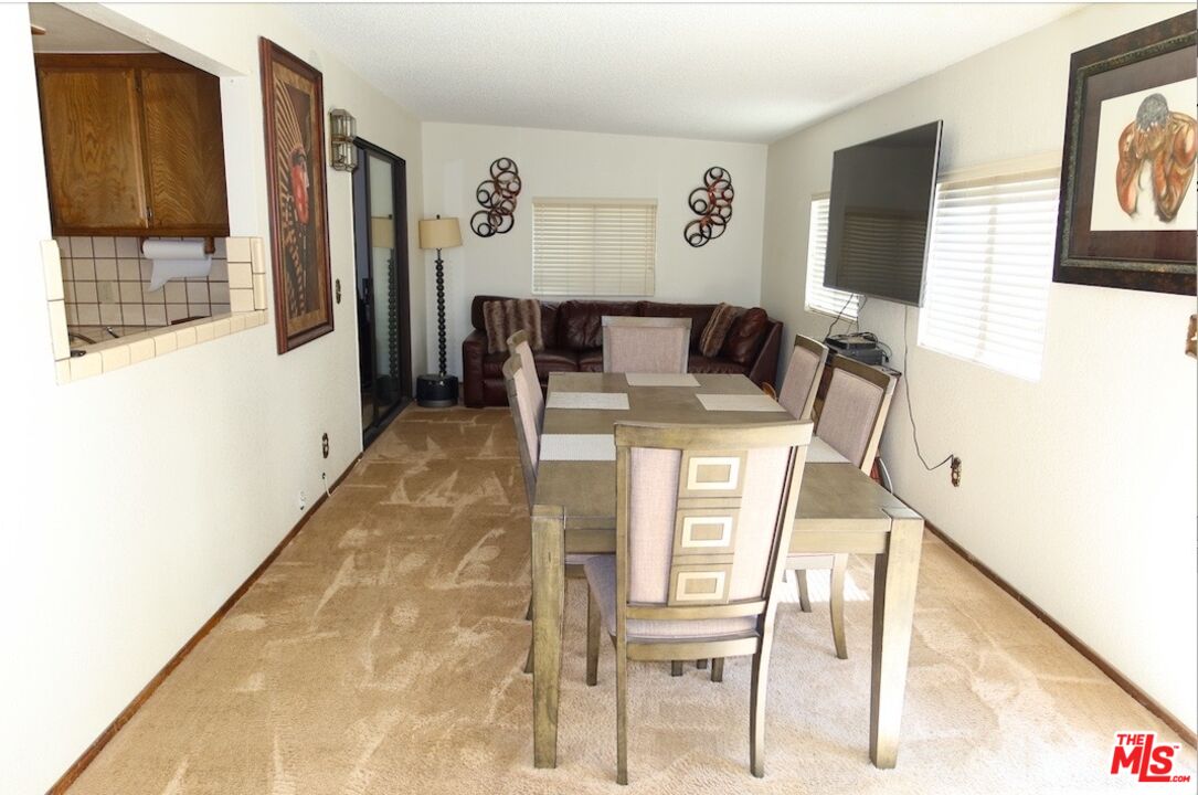 13330 Tamarisk Road Victorville, CA 92395 - Photo 16 of 33 a dining room with furniture and window