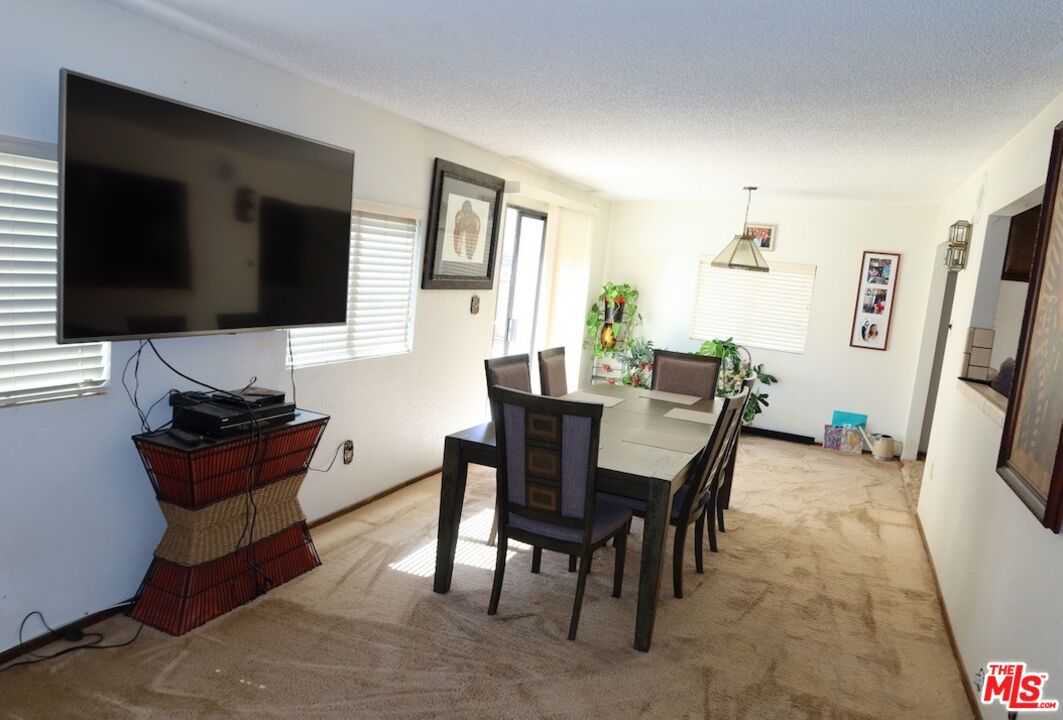 13330 Tamarisk Road Victorville, CA 92395 - Photo 17 of 33 a view of a livingroom with furniture and a flat screen tv