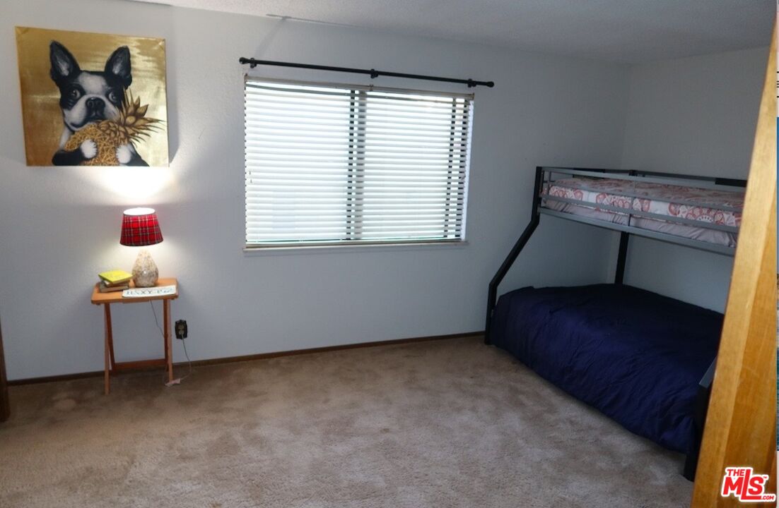 13330 Tamarisk Road Victorville, CA 92395 - Photo 25 of 33 a room with window and a table