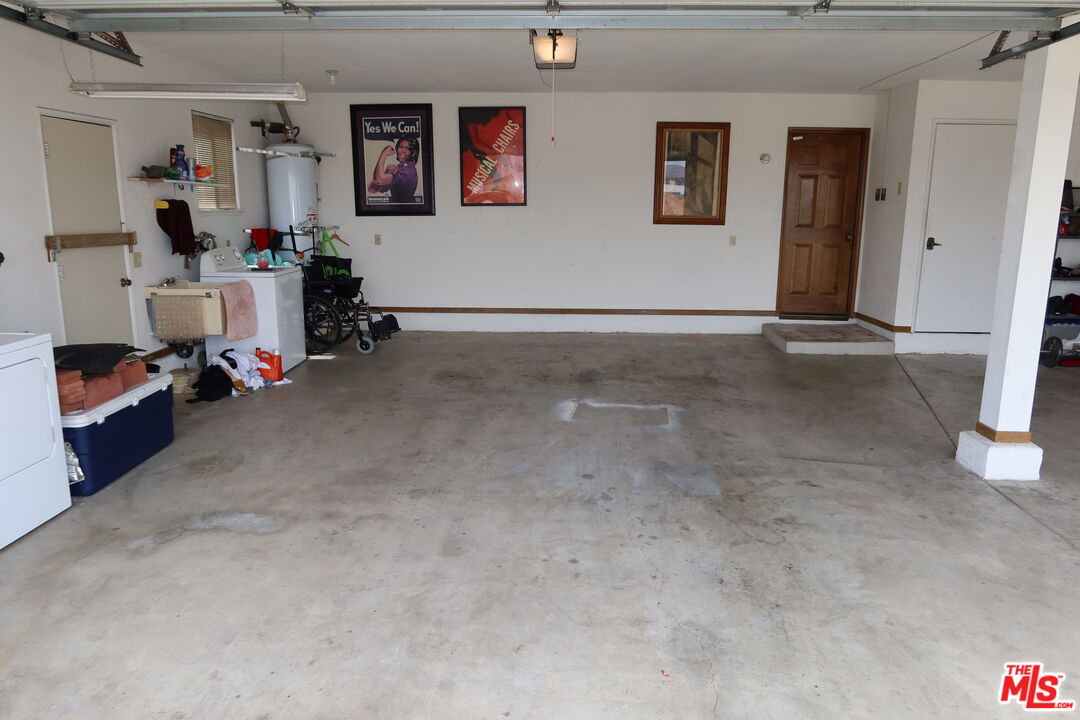 13330 Tamarisk Road Victorville, CA 92395 - Photo 3 of 33 a view of livingroom with furniture and closet