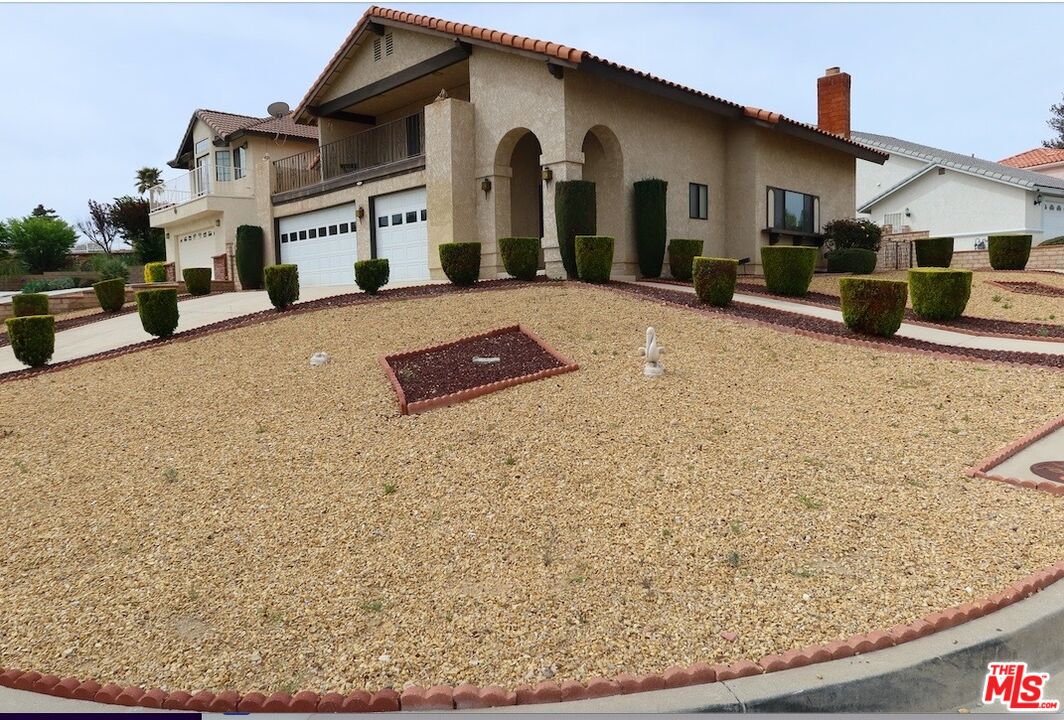 13330 Tamarisk Road Victorville, CA 92395 - Photo 33 of 33 a front view of a house with large trees
