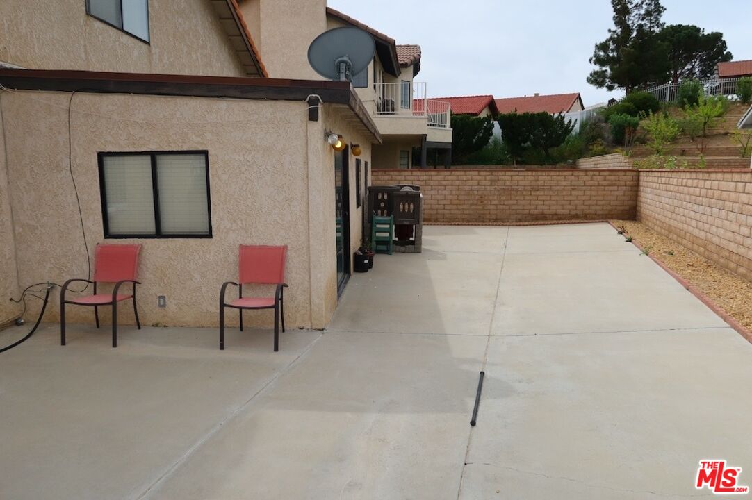 13330 Tamarisk Road Victorville, CA 92395 - Photo 8 of 33 a terrace with outdoor seating and trees