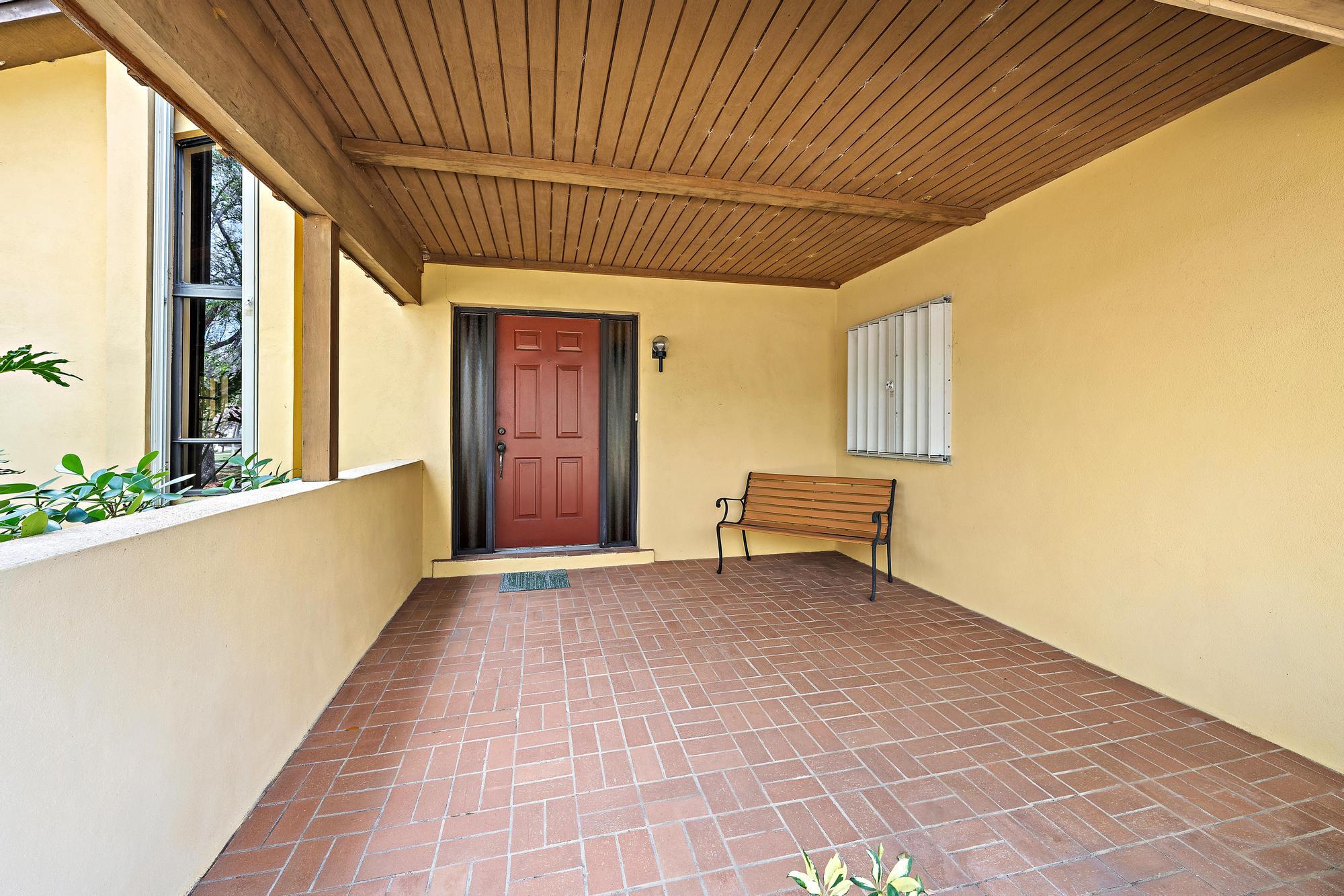 8090 Native Dancer Road East Palm Beach Gardens, FL 33418 - Photo 20 of 26 Covered Porch