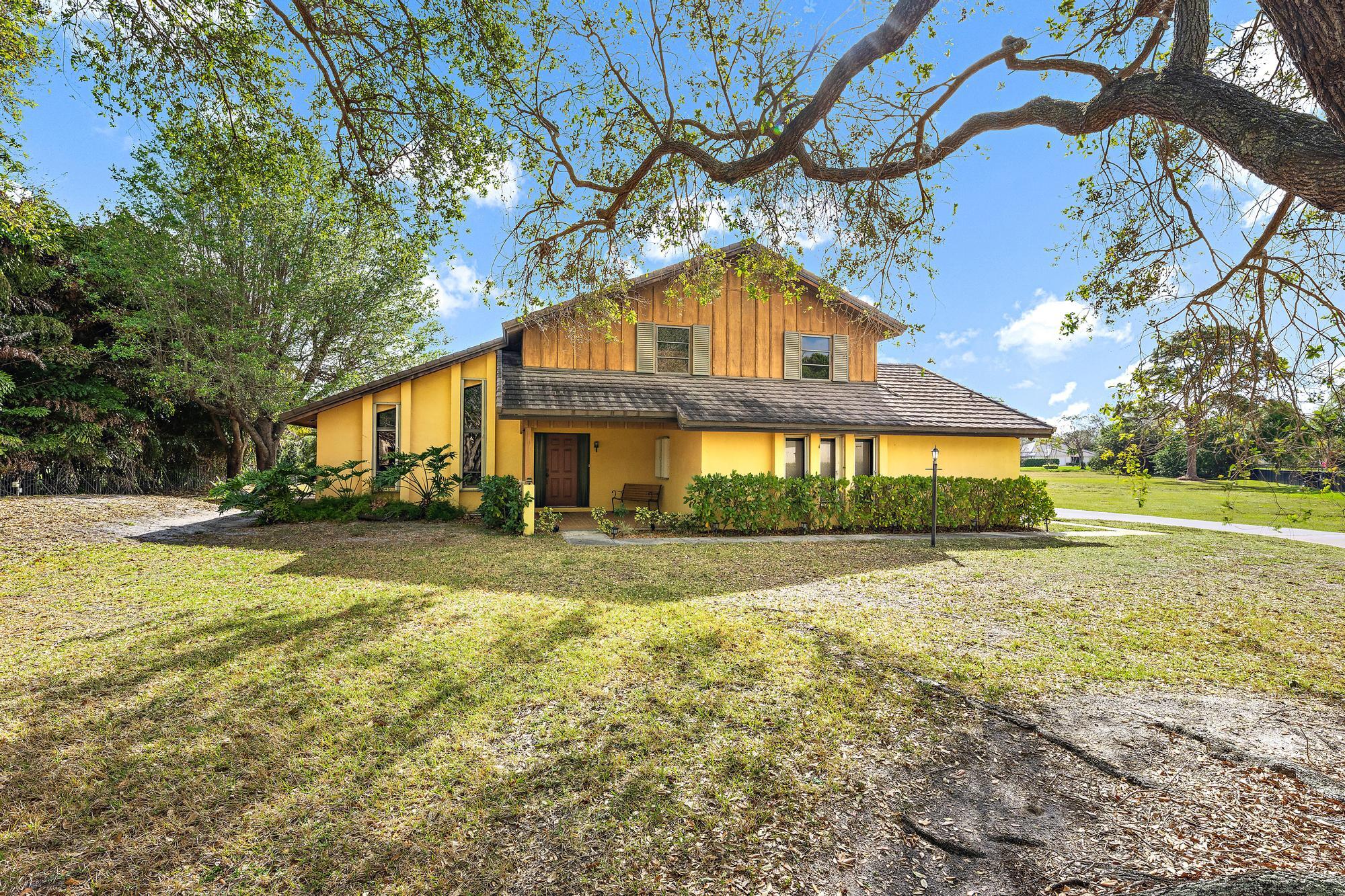 8090 Native Dancer Road East Palm Beach Gardens, FL 33418 - Photo 21 of 26 Front Exterior