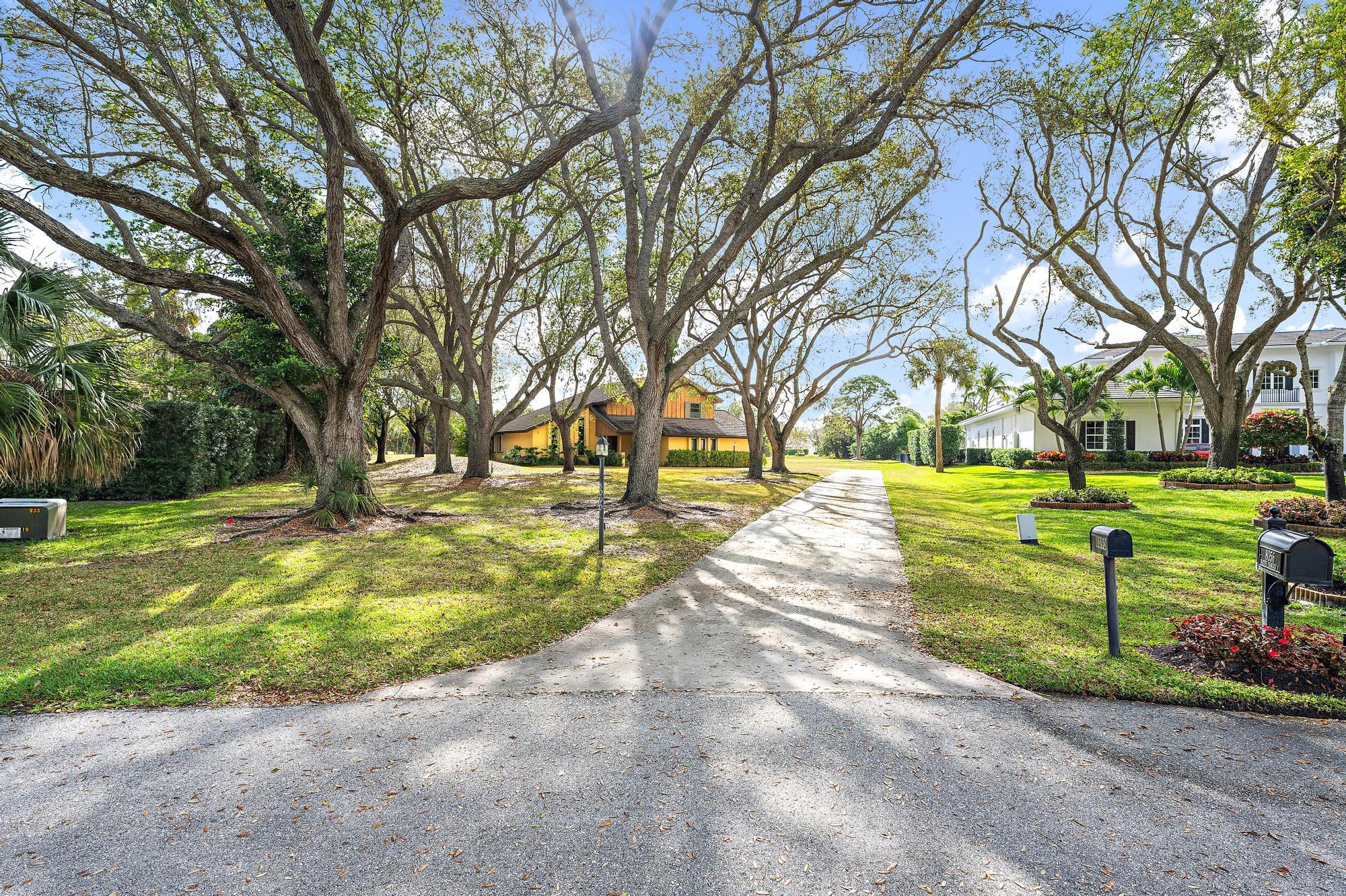 8090 Native Dancer Road East Palm Beach Gardens, FL 33418 - Photo 22 of 26 Front Exterior