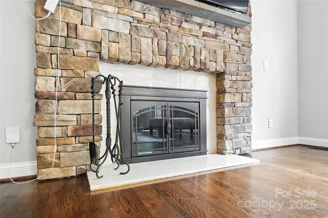 a view of fireplace and wooden floor