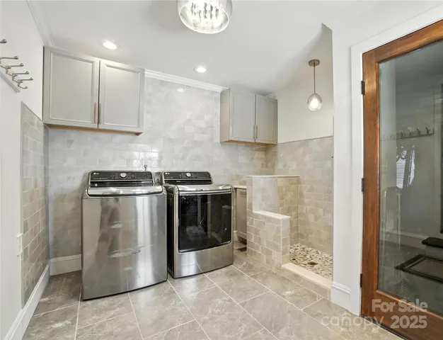 a kitchen with a sink and stainless steel appliances