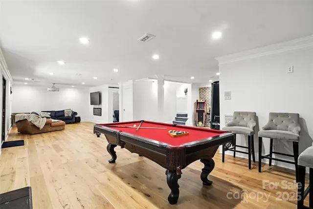 a room with furniture and pool table