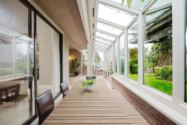 a lobby with furniture and garden view