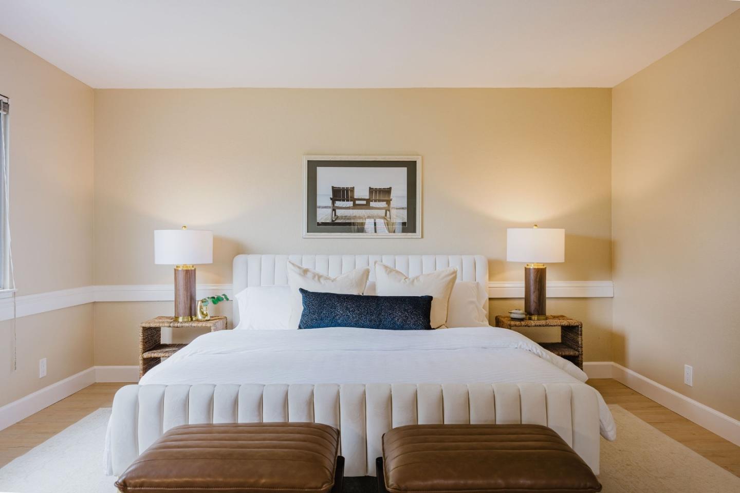 2329 Burning Tree Road Half Moon Bay, CA 94019 - Photo 15 of 35 a bedroom with a bed and a lamp