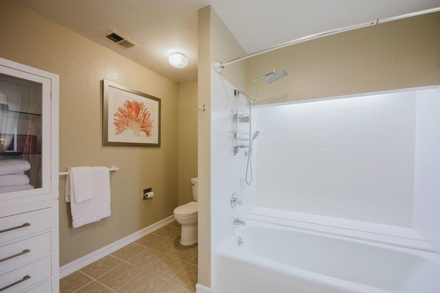 2329 Burning Tree Road Half Moon Bay, CA 94019 - Photo 19 of 35 a bathroom with a bathtub and a shower