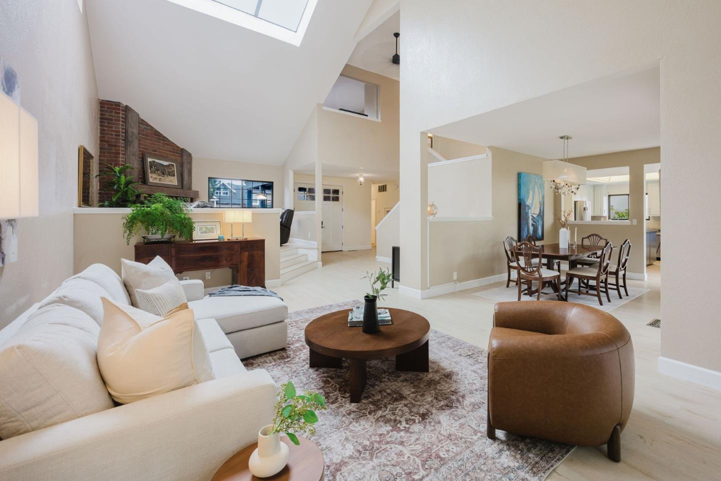 2329 Burning Tree Road Half Moon Bay, CA 94019 - Photo 2 of 35 a living room with furniture a lamp and a fireplace