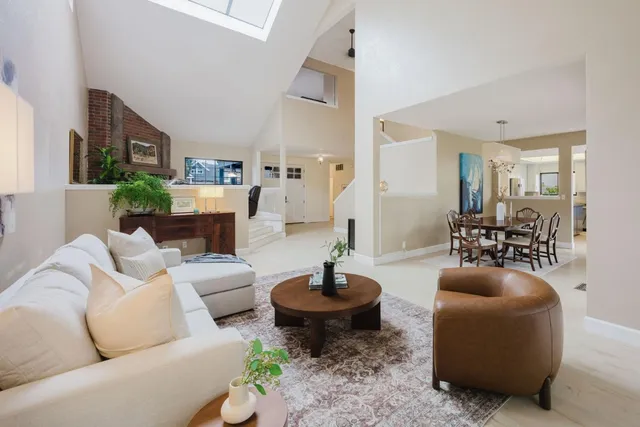 a living room with furniture a lamp and a fireplace
