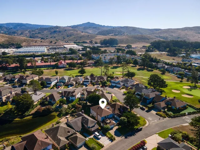 an aerial view of residential houses and outdoor space
