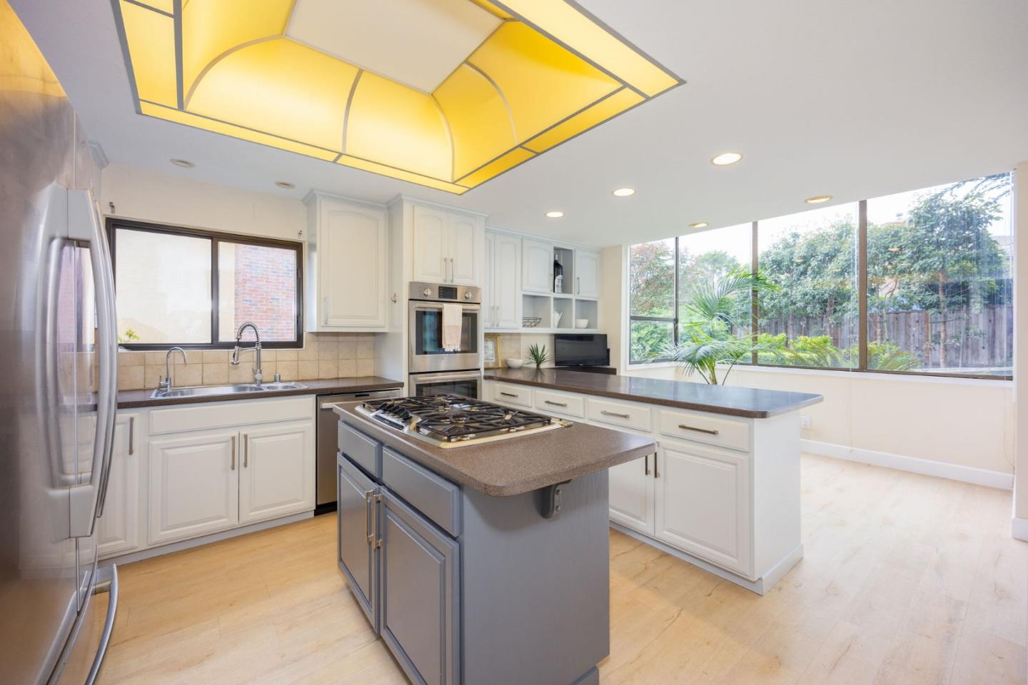 2329 Burning Tree Road Half Moon Bay, CA 94019 - Photo 5 of 35 a kitchen with stainless steel appliances granite countertop a stove a sink and a refrigerator