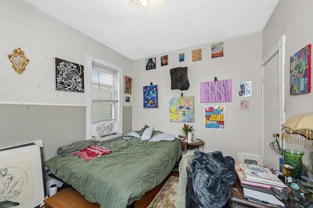 19 Dewolf Street Boston, MA 02125 - Photo 12 of 30 a bedroom with furniture and a bed