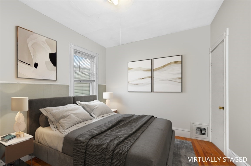 19 Dewolf Street Boston, MA 02125 - Photo 13 of 30 a bedroom with a bed and a painting on the wall
