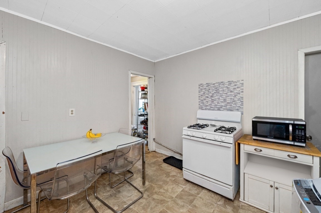 19 Dewolf Street Boston, MA 02125 - Photo 17 of 30 a view of kitchen and wooden floor