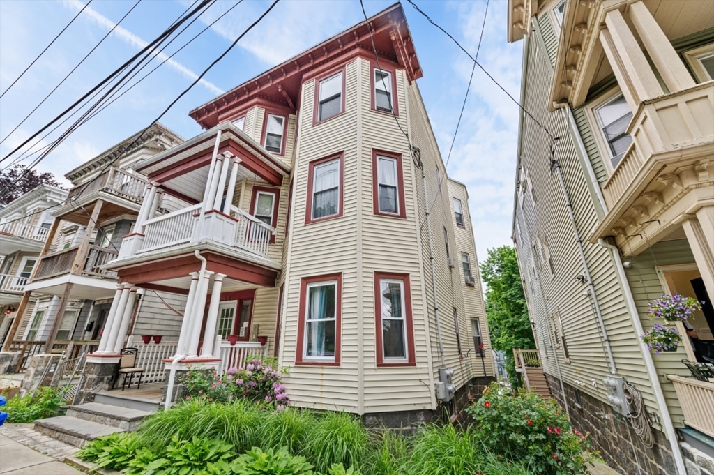 19 Dewolf Street Boston, MA 02125 - Photo 29 of 30 a view of a house with a yard