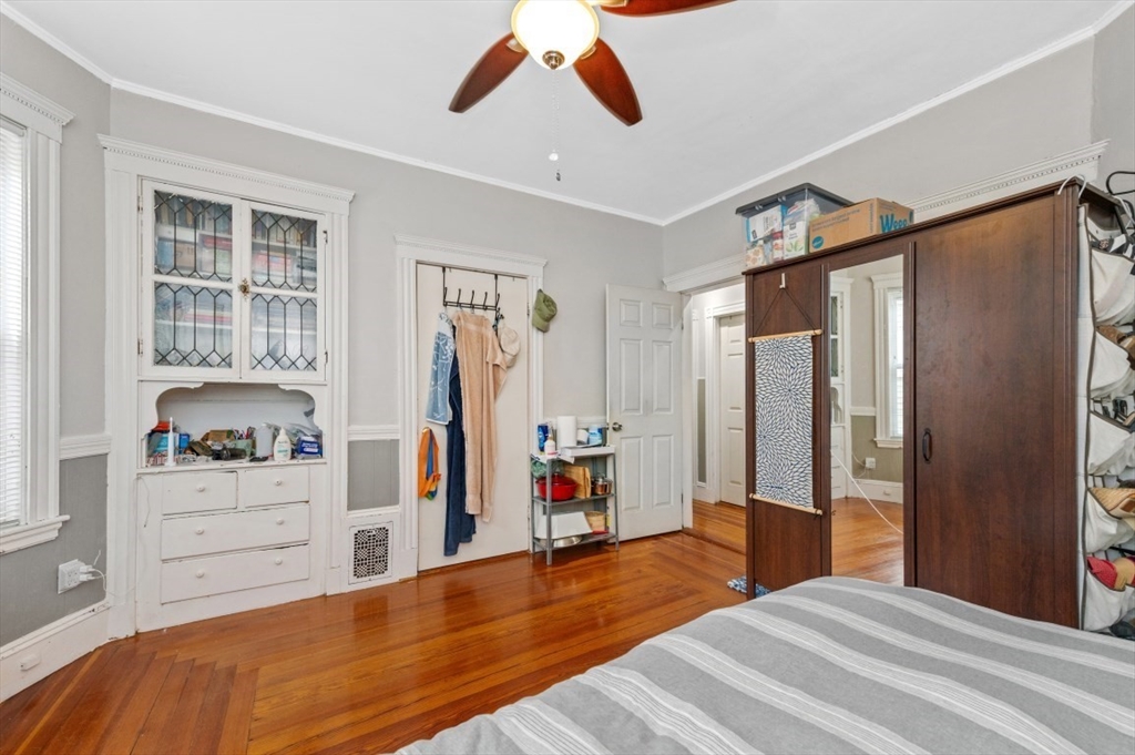 19 Dewolf Street Boston, MA 02125 - Photo 7 of 30 a bedroom with a bed and a closet