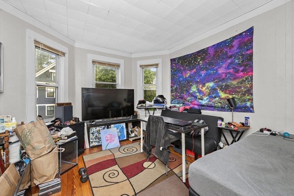 19 Dewolf Street Boston, MA 02125 - Photo 8 of 30 a view of a livingroom with furniture and a flat screen tv