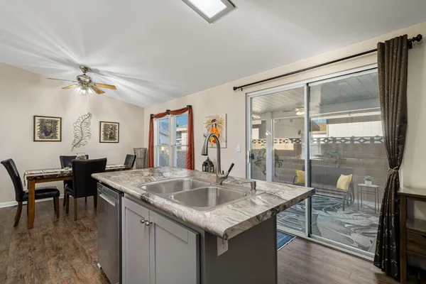 a kitchen with center island table and chairs