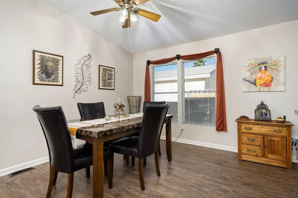 a view of a dining room with furniture window and wooden floor