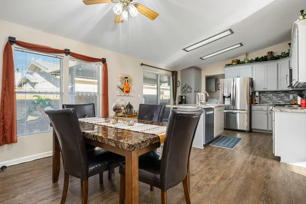 a view of a dining room with furniture window and wooden floor
