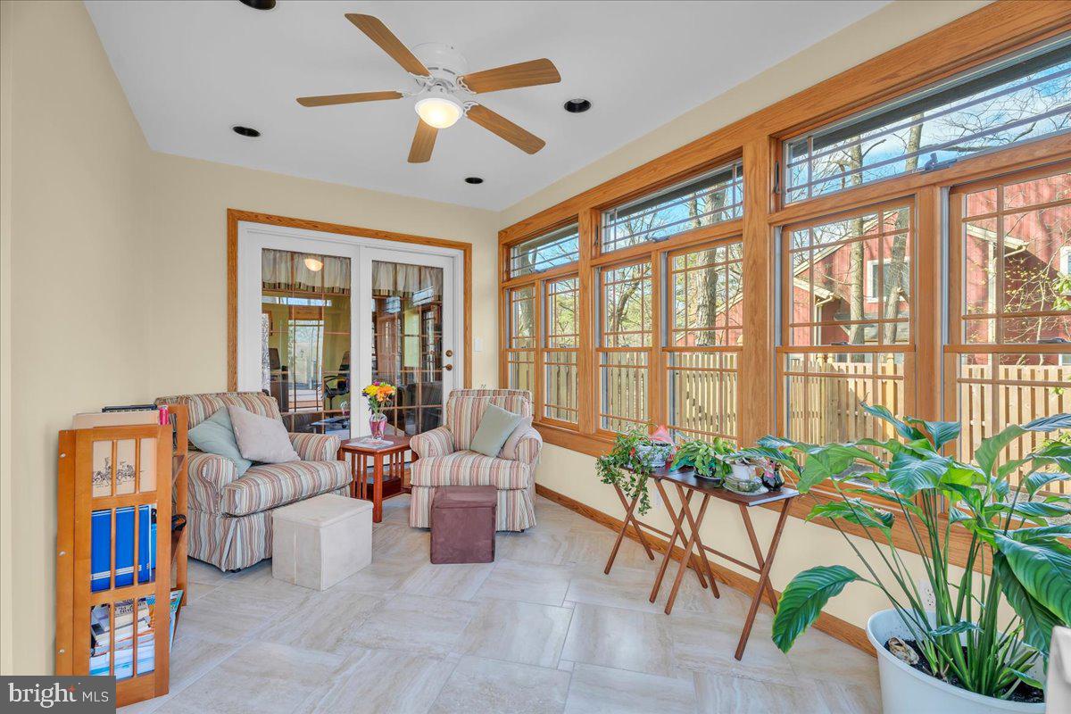 6 Edelweiss Lane Voorhees, NJ 08043 - Photo 16 of 46 a living room with patio furniture and a large window