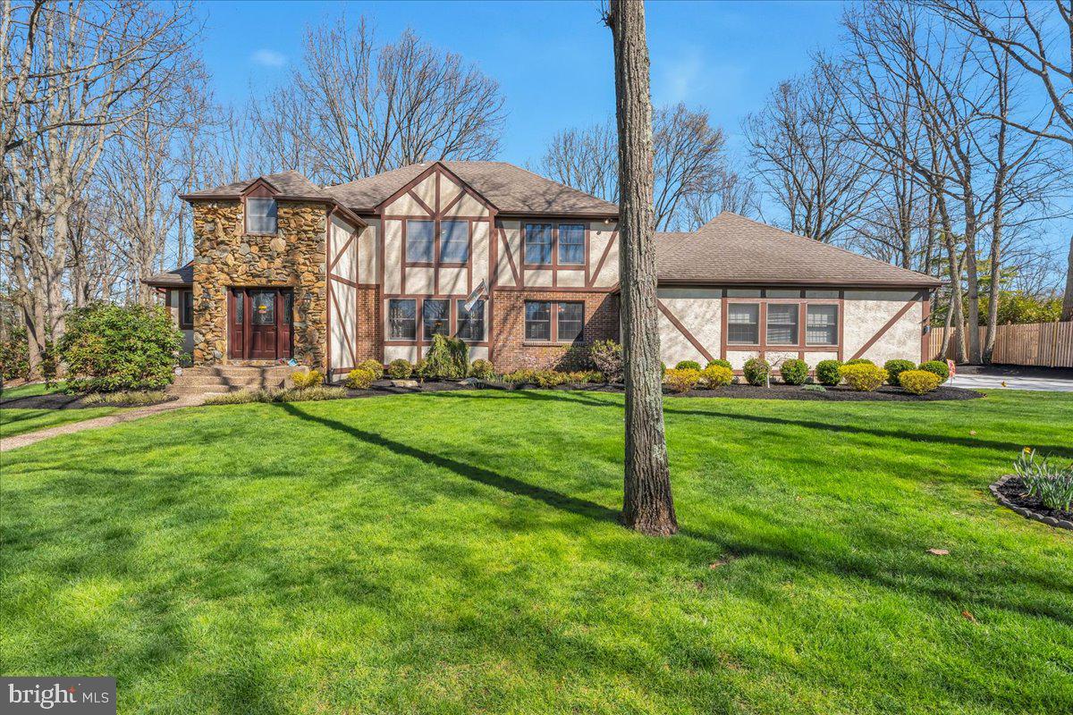 6 Edelweiss Lane Voorhees, NJ 08043 - Photo 2 of 46 a front view of a house with a yard and trees
