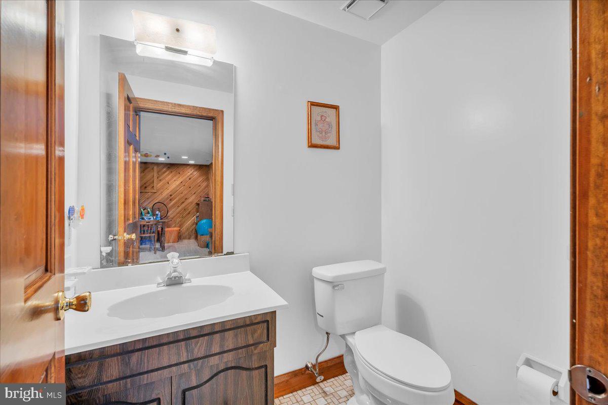 6 Edelweiss Lane Voorhees, NJ 08043 - Photo 21 of 46 a bathroom with a sink a toilet and mirror