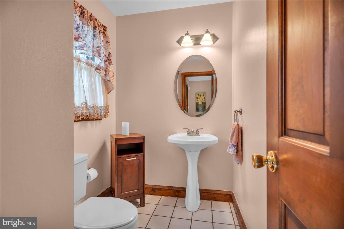 6 Edelweiss Lane Voorhees, NJ 08043 - Photo 22 of 46 a bathroom with a toilet sink and mirror