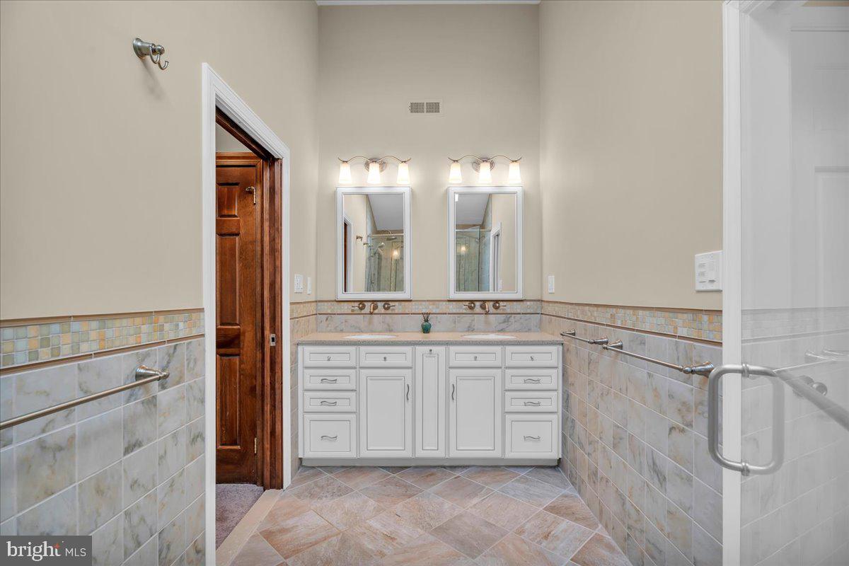 6 Edelweiss Lane Voorhees, NJ 08043 - Photo 26 of 46 a bathroom with a double vanity sink and a mirror
