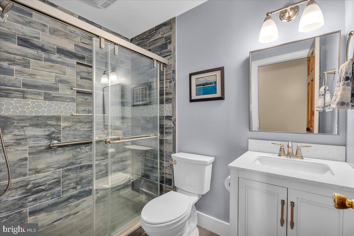 6 Edelweiss Lane Voorhees, NJ 08043 - Photo 32 of 46 a bathroom with a toilet a sink and shower