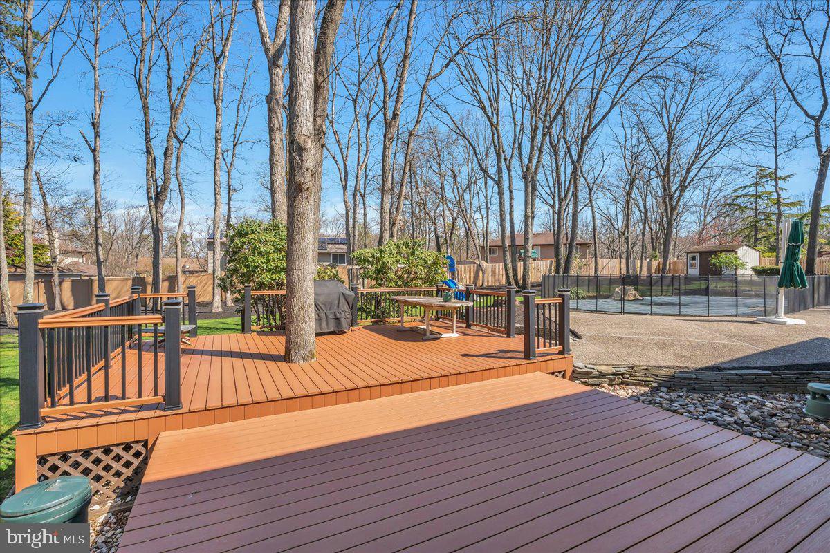 6 Edelweiss Lane Voorhees, NJ 08043 - Photo 33 of 46 a view of swimming pool with chairs and wooden fence