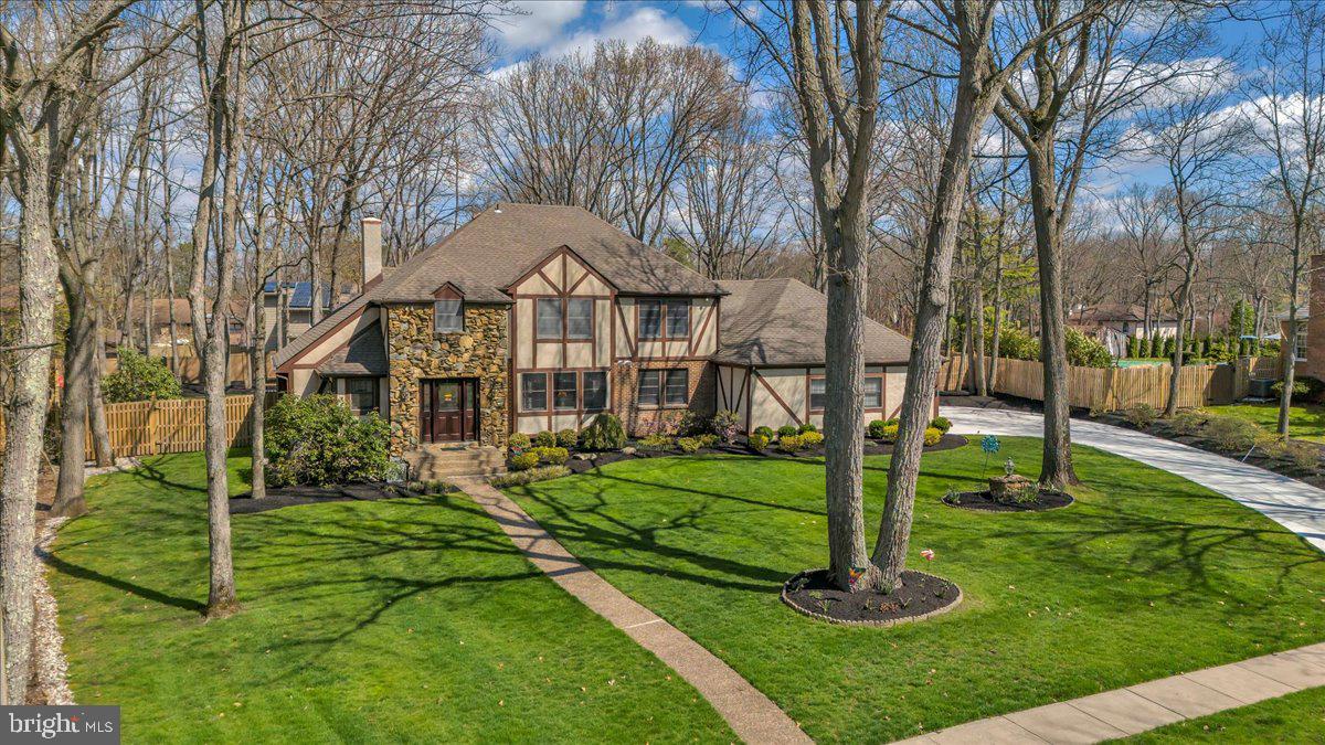 6 Edelweiss Lane Voorhees, NJ 08043 - Photo 44 of 46 a front view of a house with a yard