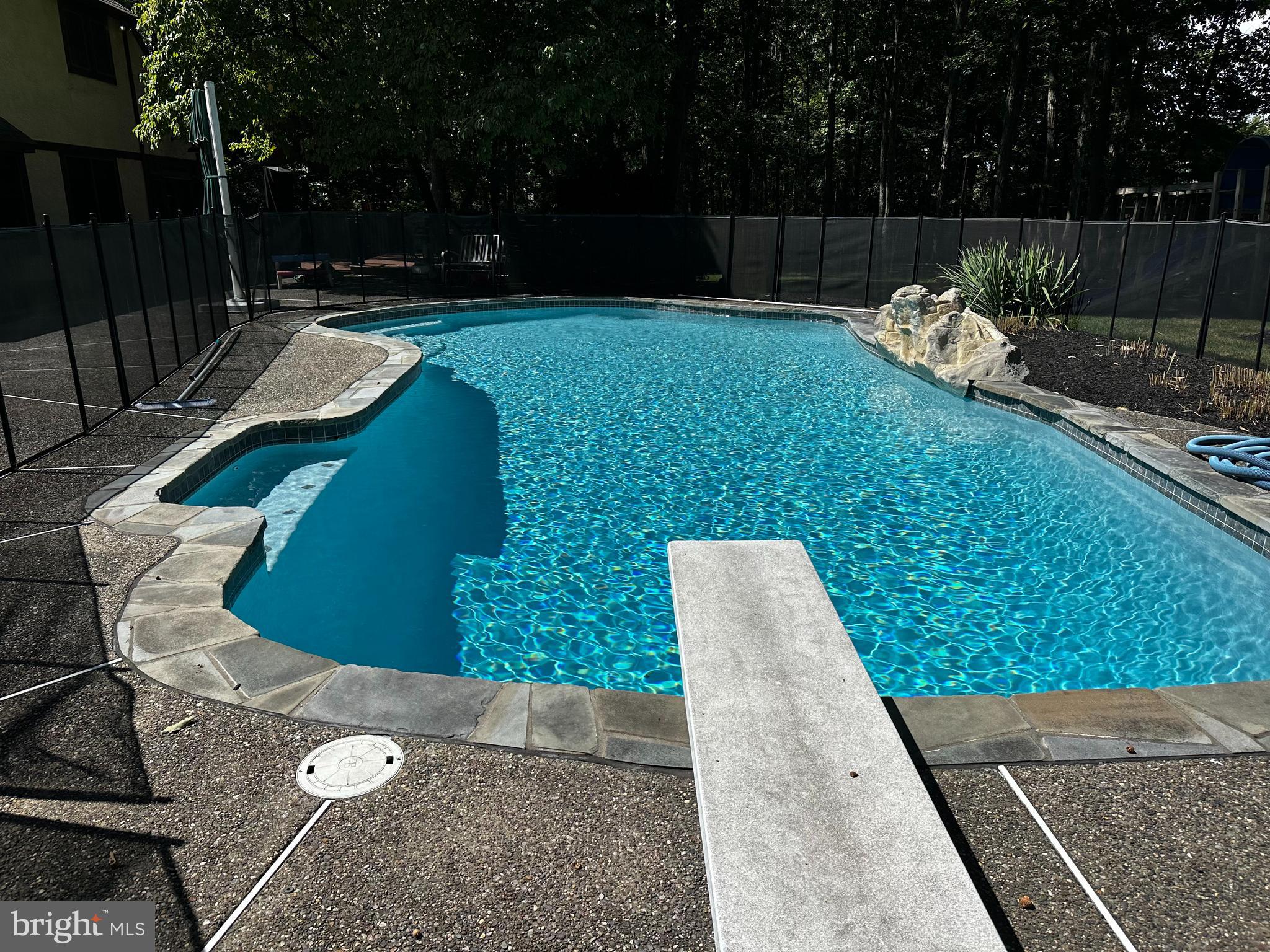 6 Edelweiss Lane Voorhees, NJ 08043 - Photo 45 of 46 a view of a backyard with sitting area