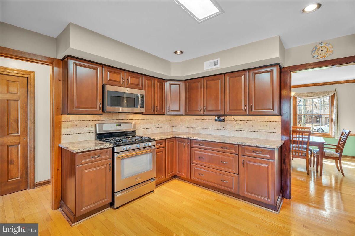 6 Edelweiss Lane Voorhees, NJ 08043 - Photo 9 of 46 a kitchen with stainless steel appliances granite countertop a stove a sink dishwasher and a refrigerator