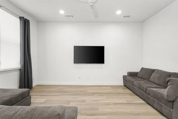 a living room with a couch and a flat screen tv
