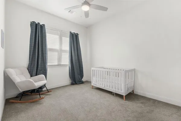 a view of room with windows and lounge chair