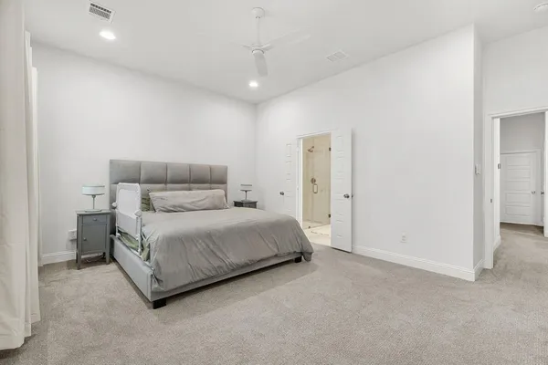 a room with a bed and a night stand