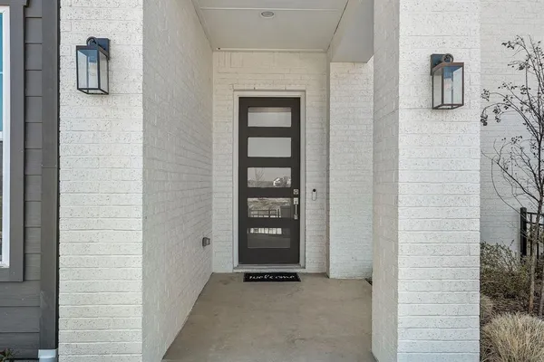 a view of an entryway with wooden floor