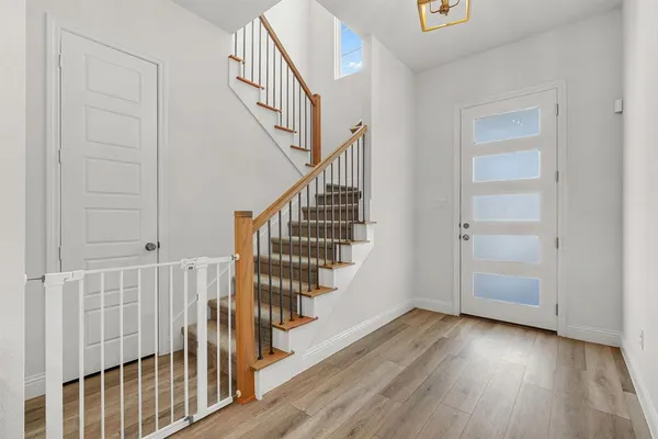 a view of entryway with wooden floor